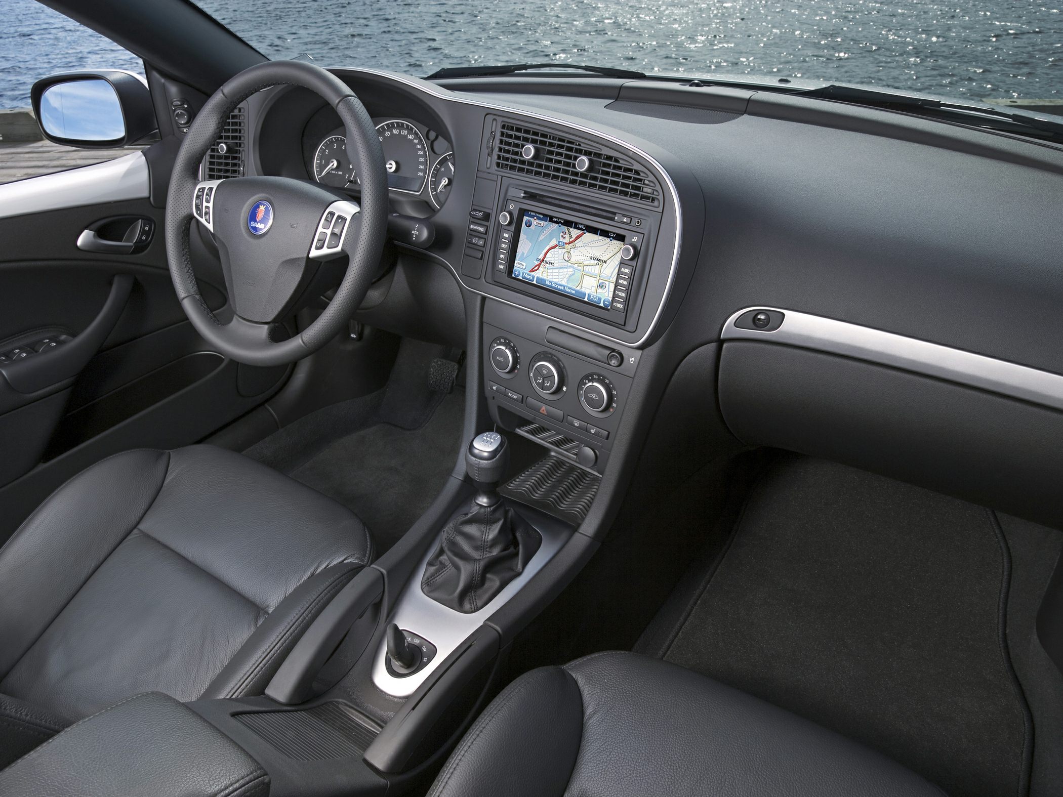 Dashboard with navigation screen and manual gear shifter