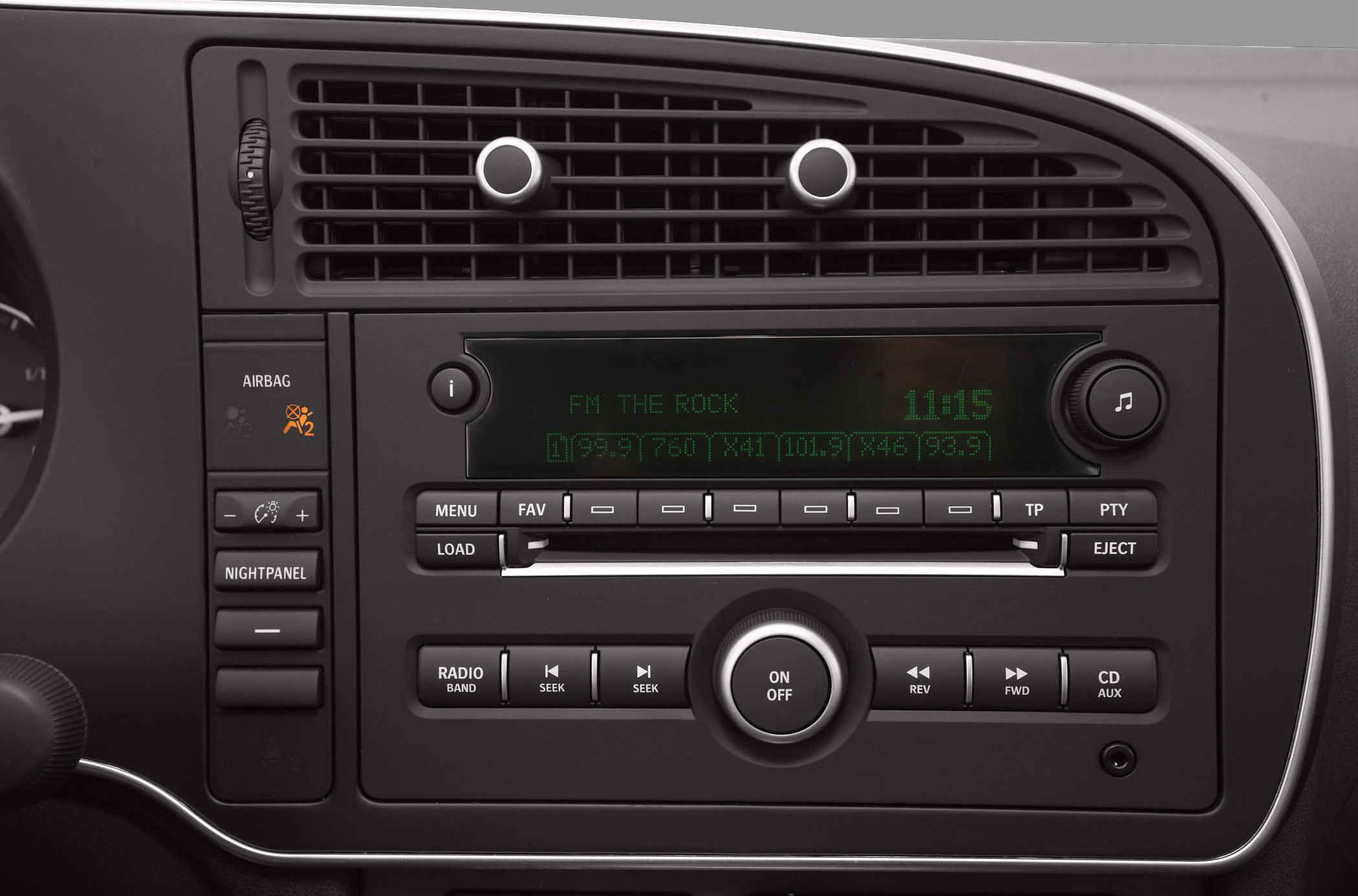 Dashboard radio and climate control with air vent knobs