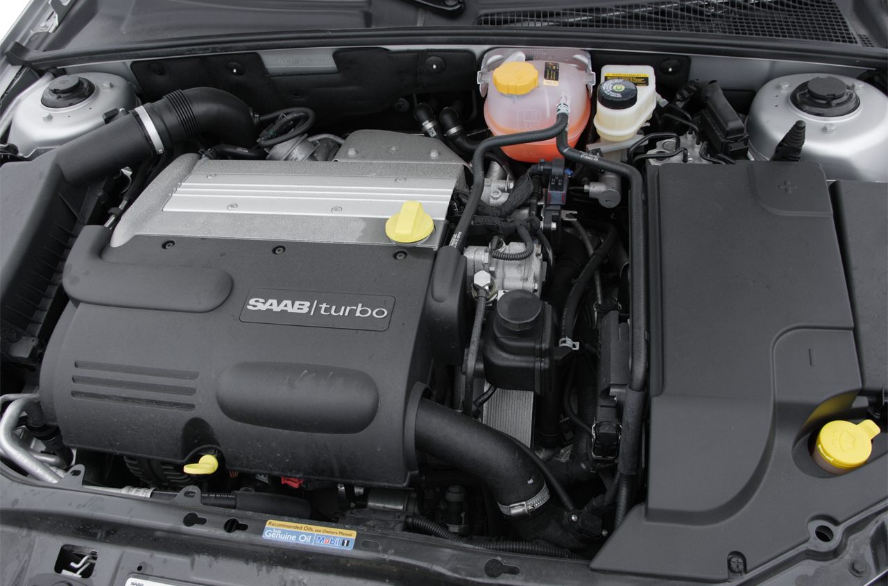 Close-up of turbocharged engine bay with visible components and connections