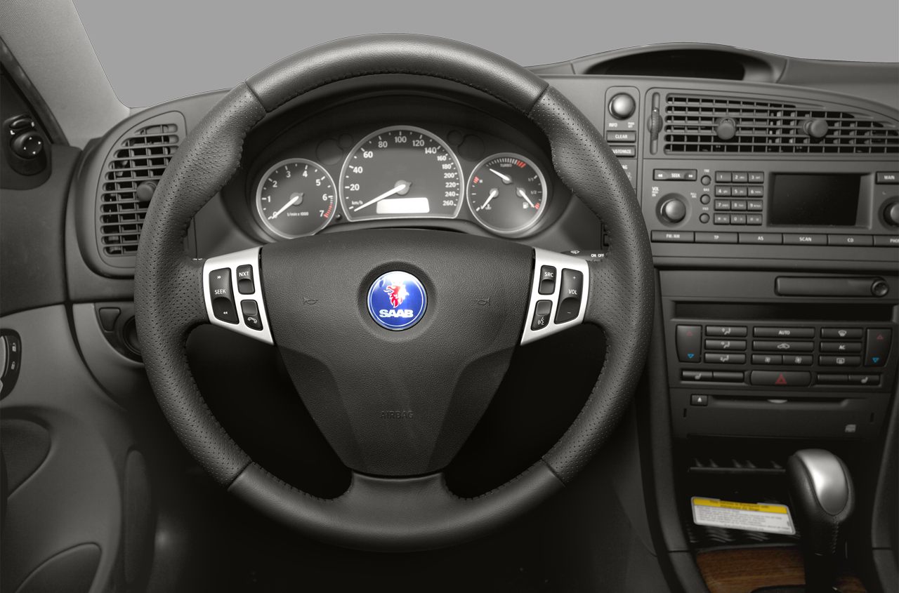 Leather steering wheel with control buttons and instrument cluster