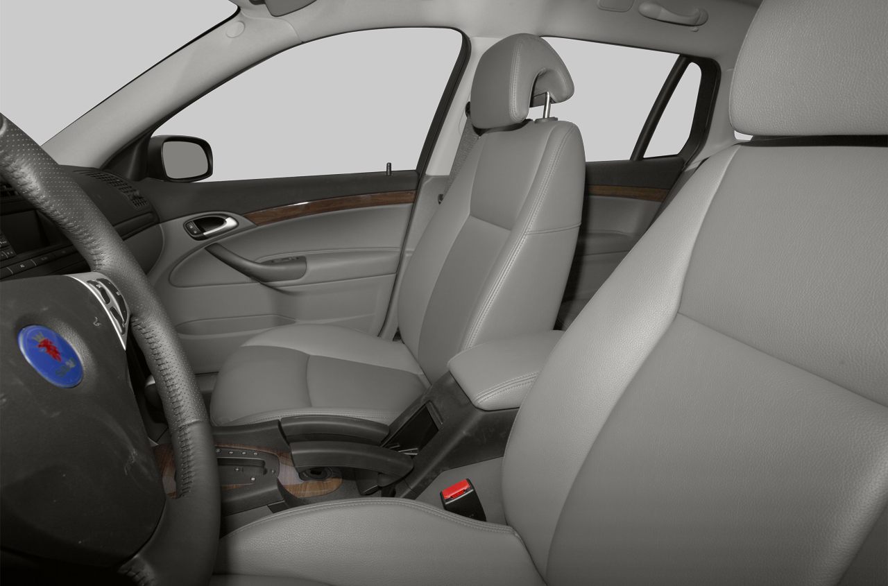 Leather seats and wood trim interior with detailed front seating area