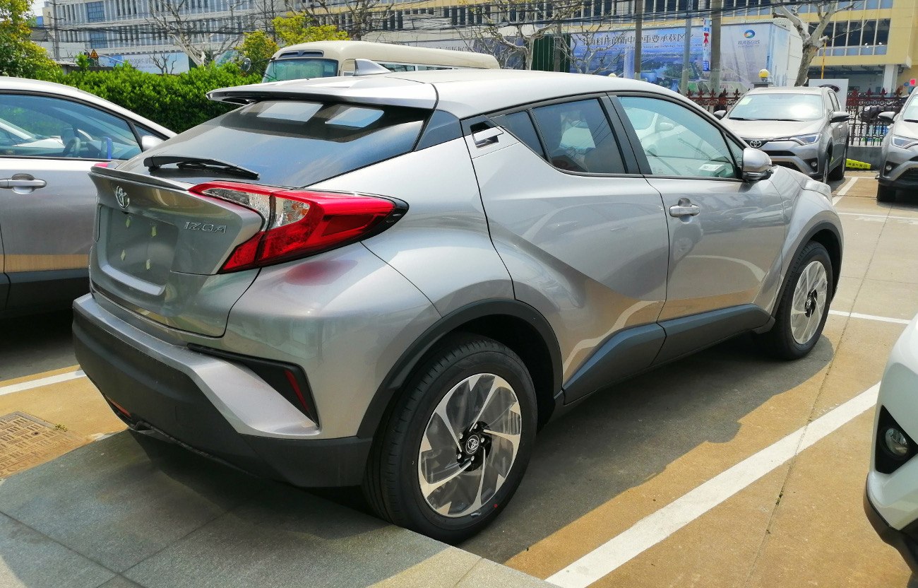 Silver compact SUV rear with angular tail lights and sloping roof spoiler
