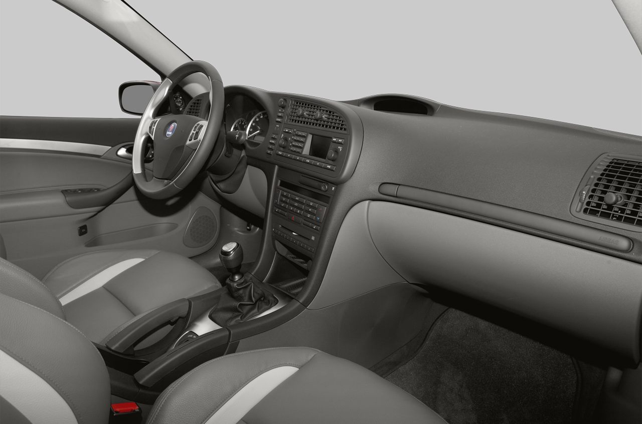 Car interior with dashboard and manual transmission gear stick