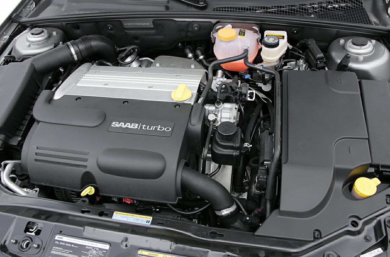 Turbocharged engine bay with detailed powertrain components.
