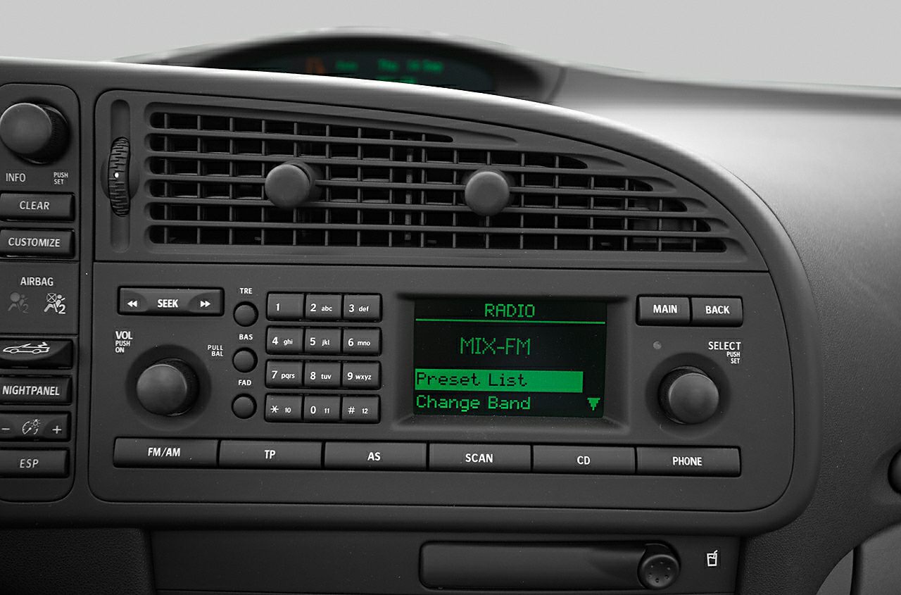Classic car dashboard with radio and climate control buttons