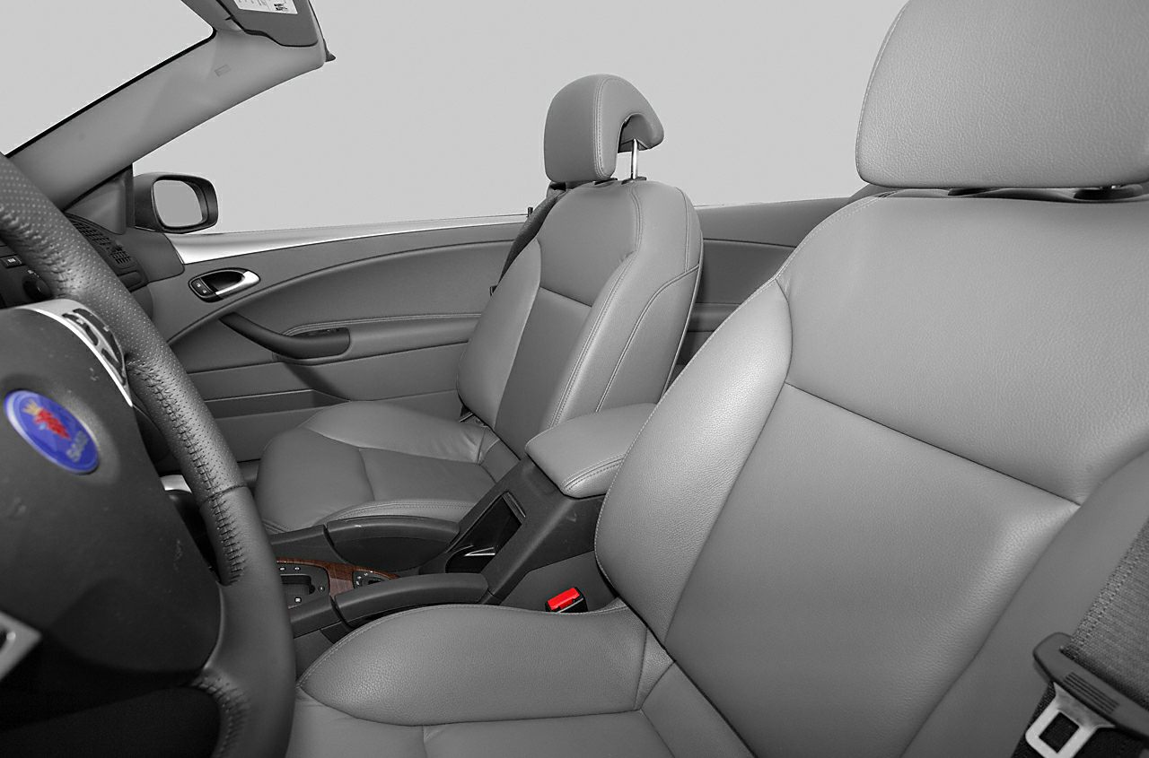 Leather seats and steering wheel of convertible car interior