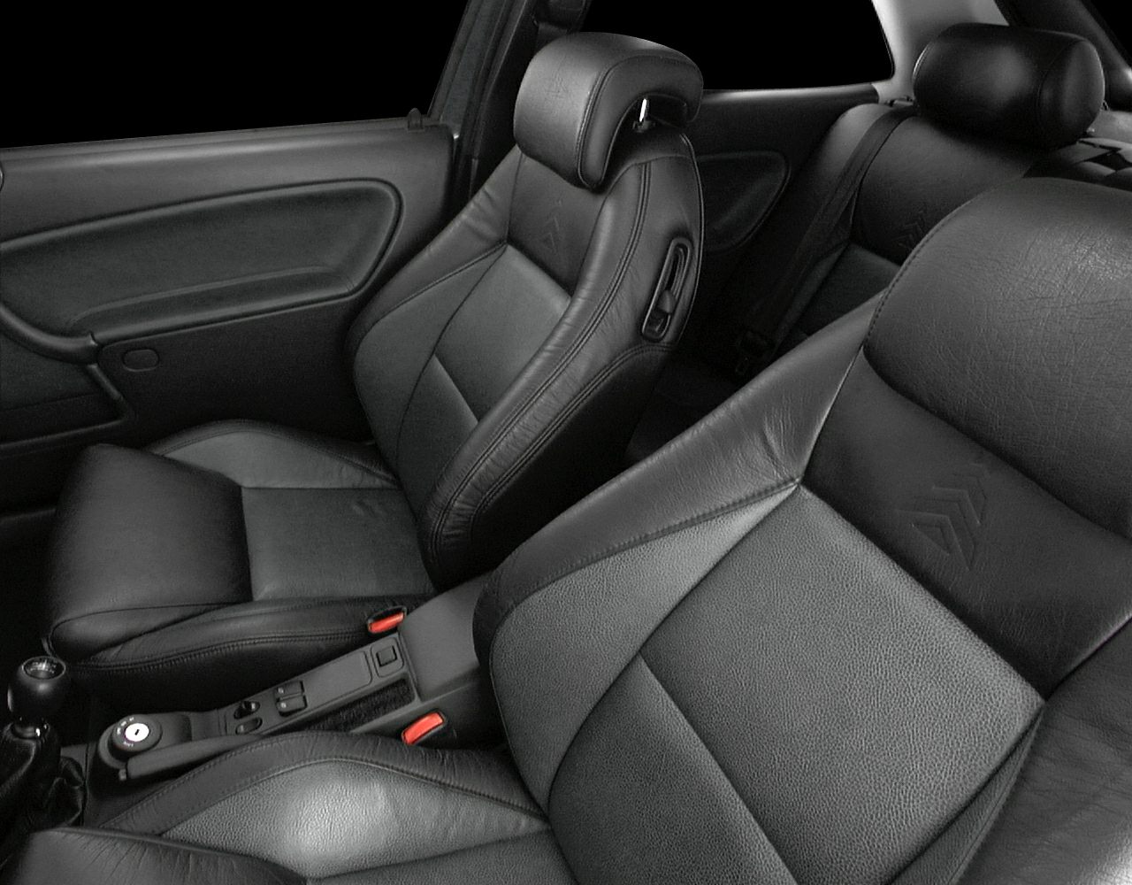 Leather seats and manual gearshift inside car