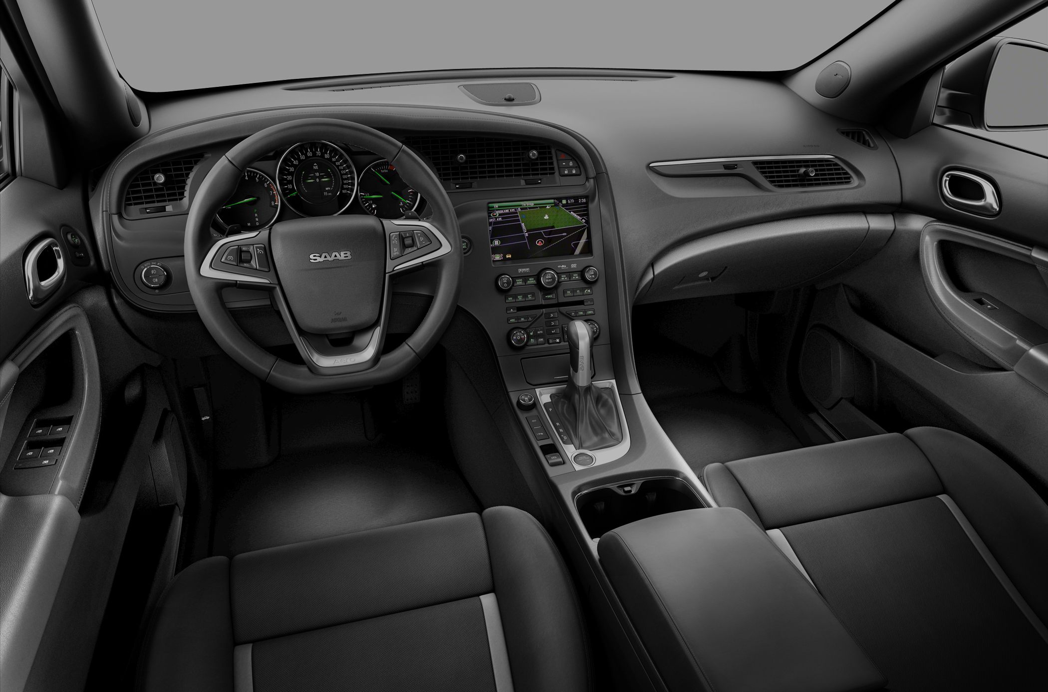 Dashboard, steering wheel, and navigation display in car interior