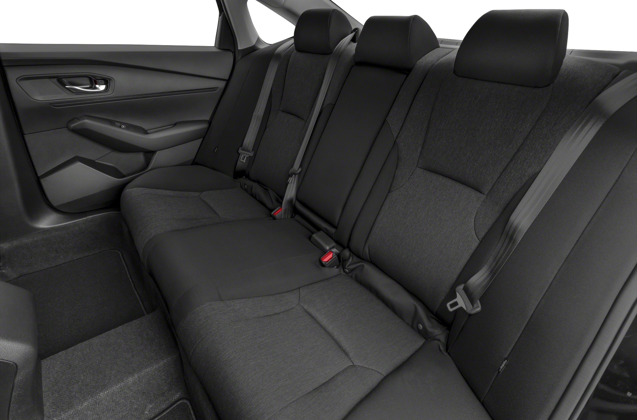 Spacious rear seat with adjustable headrests and three-point seatbelts