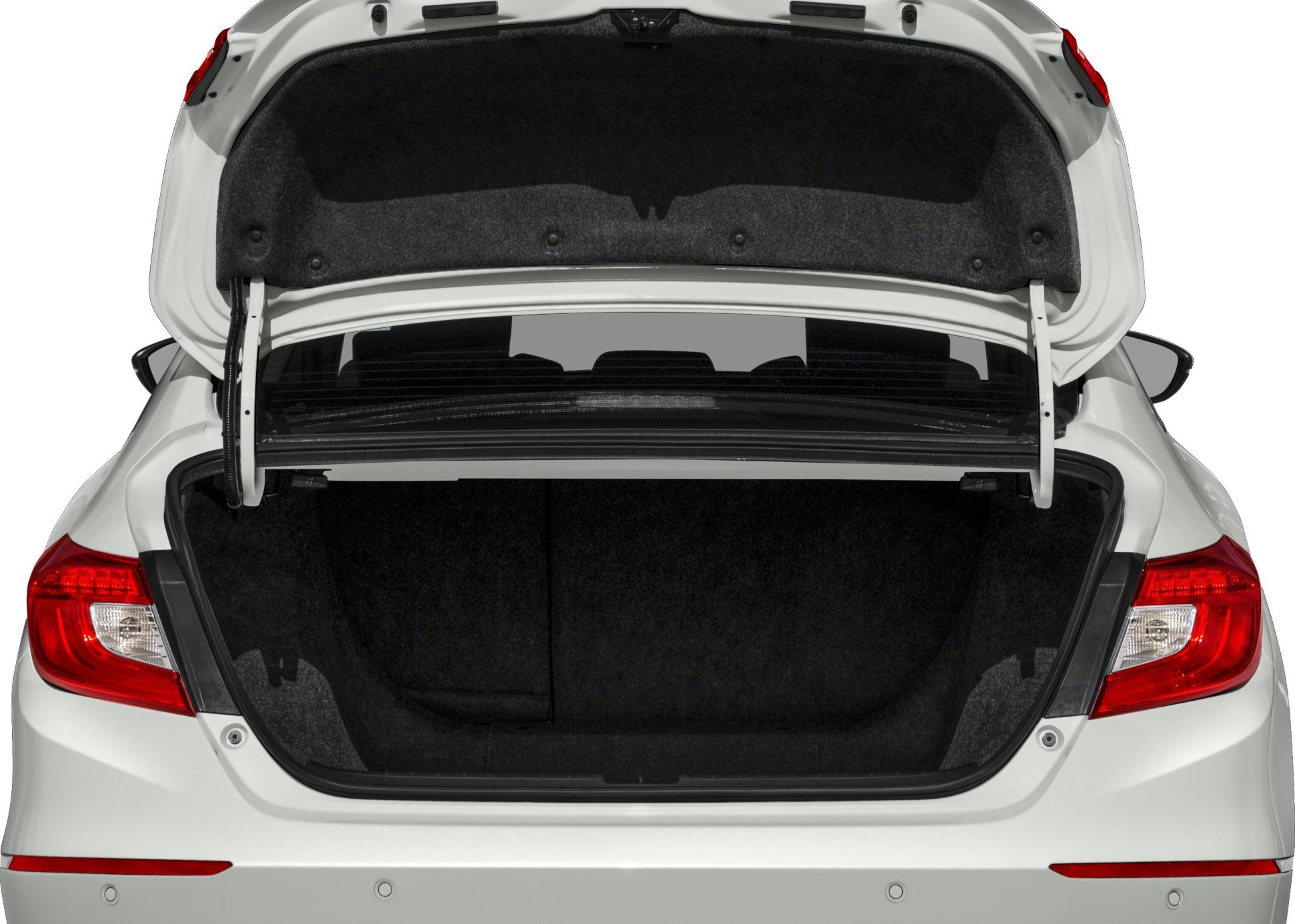 Open tailgate showing spacious carpeted trunk interior with rear lights