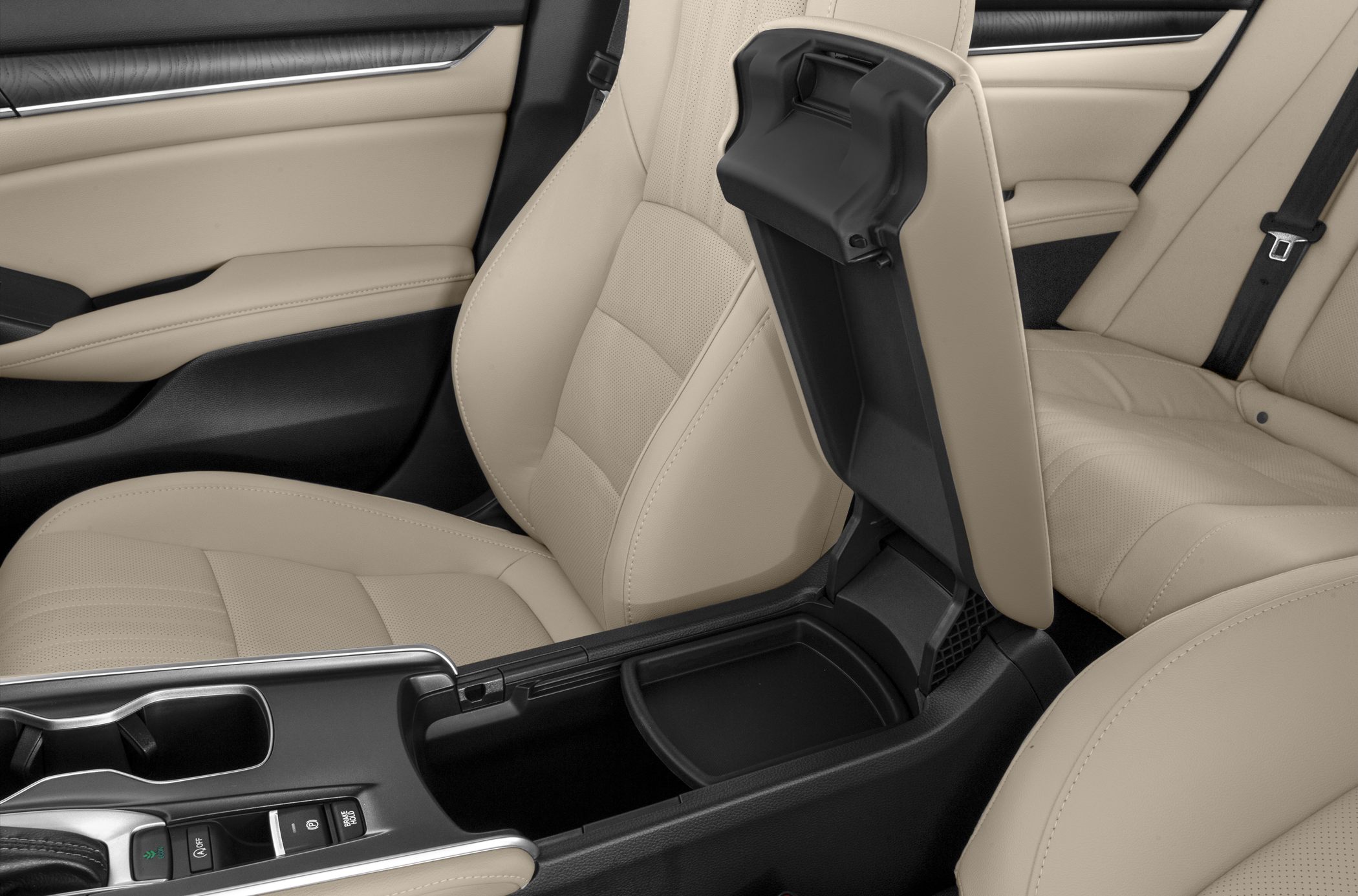 Beige seats and open center console storage compartment in car interior