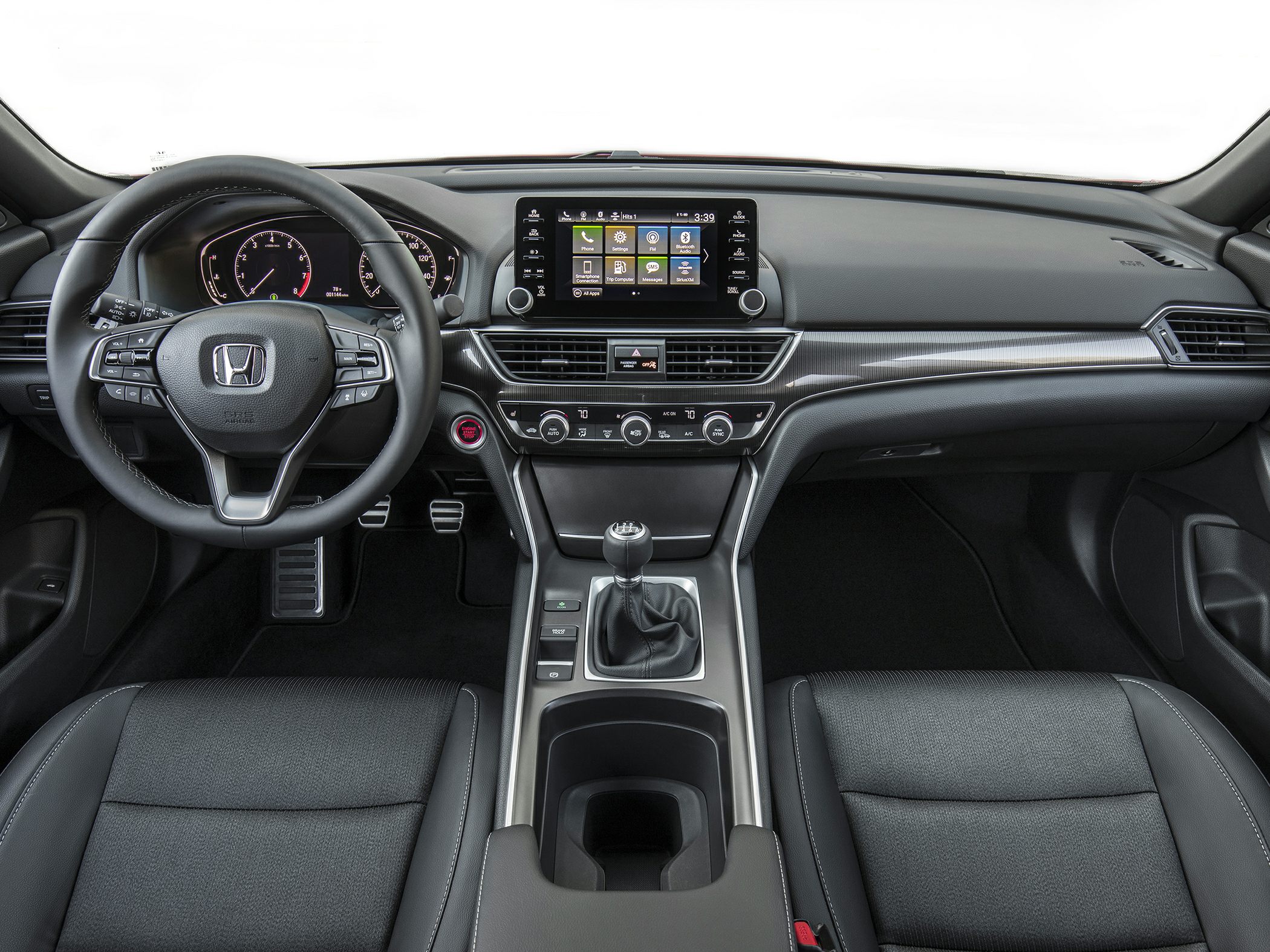 Car interior dashboard with manual transmission and touchscreen infotainment
