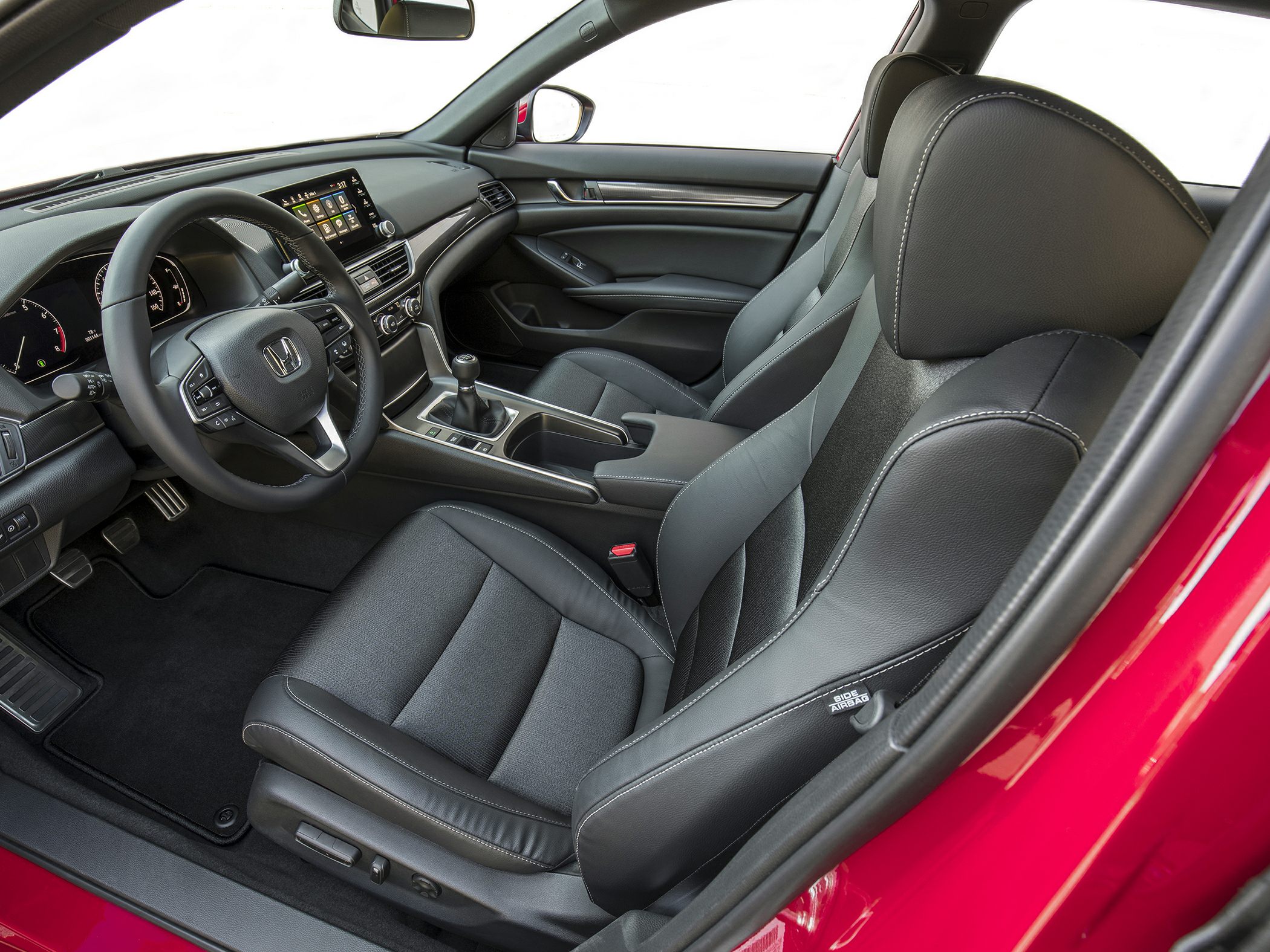 Modern car interior with leather seats and manual transmission