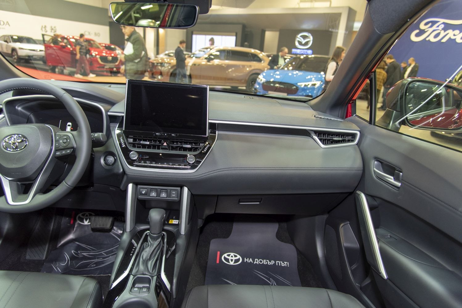 Modern dashboard and center console with touchscreen and steering wheel controls