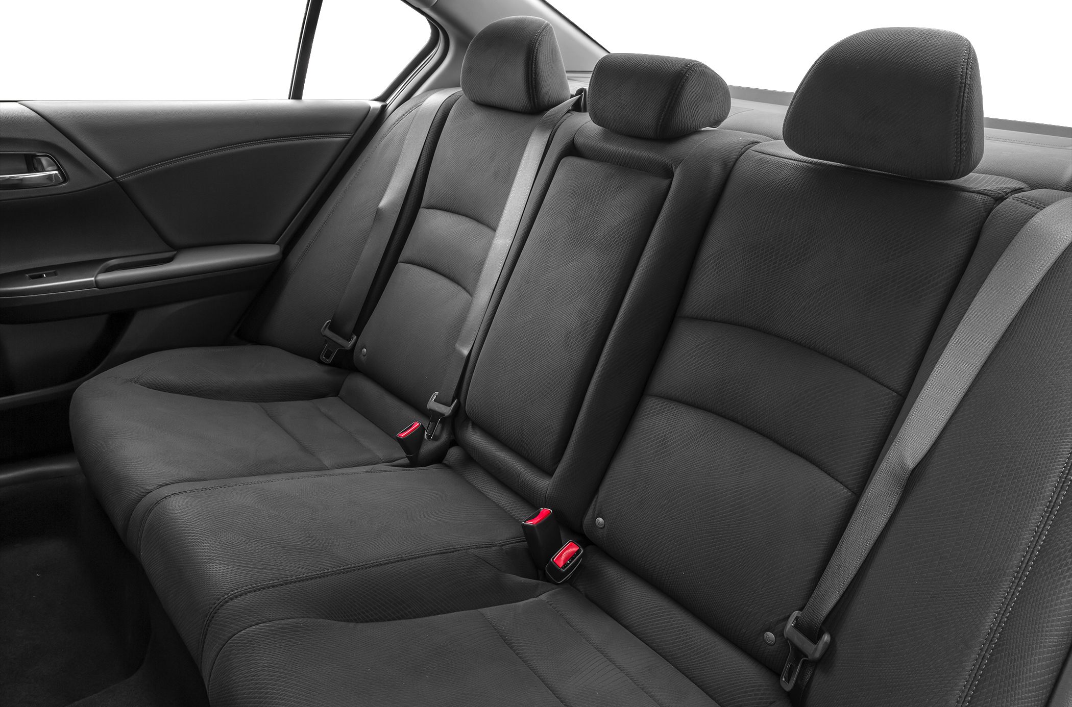Spacious rear seat with black upholstery and integrated headrests.