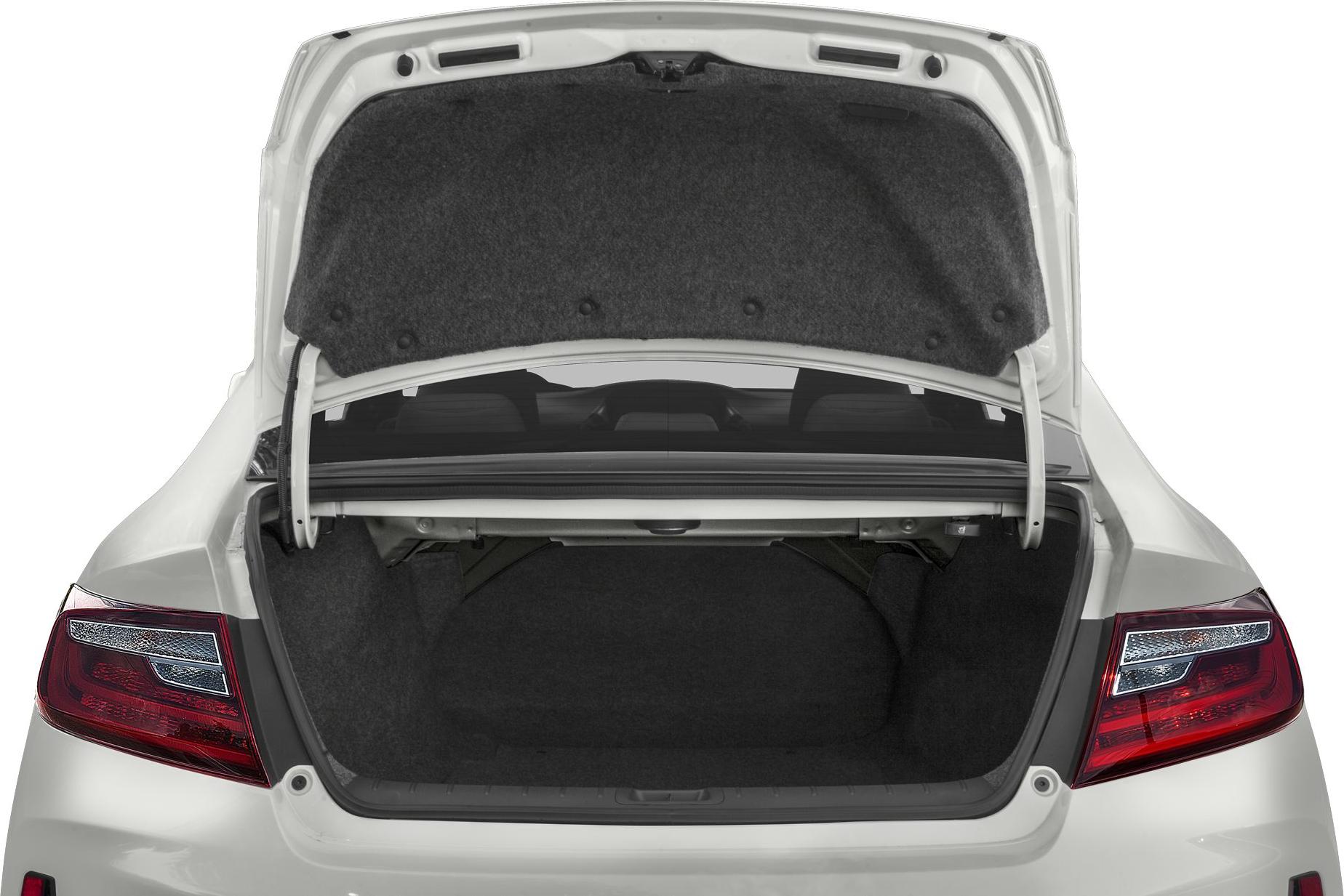 Spacious open trunk with clean interior in white coupe