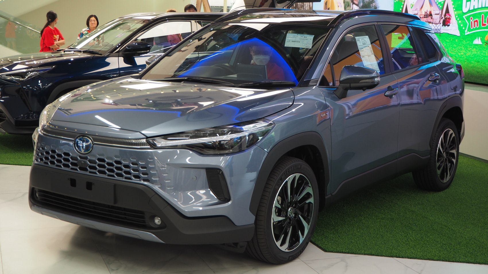 Front view of modern compact SUV with honeycomb grille and LED headlights