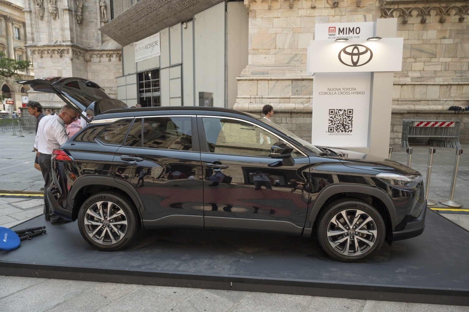 Side profile of SUV with open rear hatch and alloy wheels