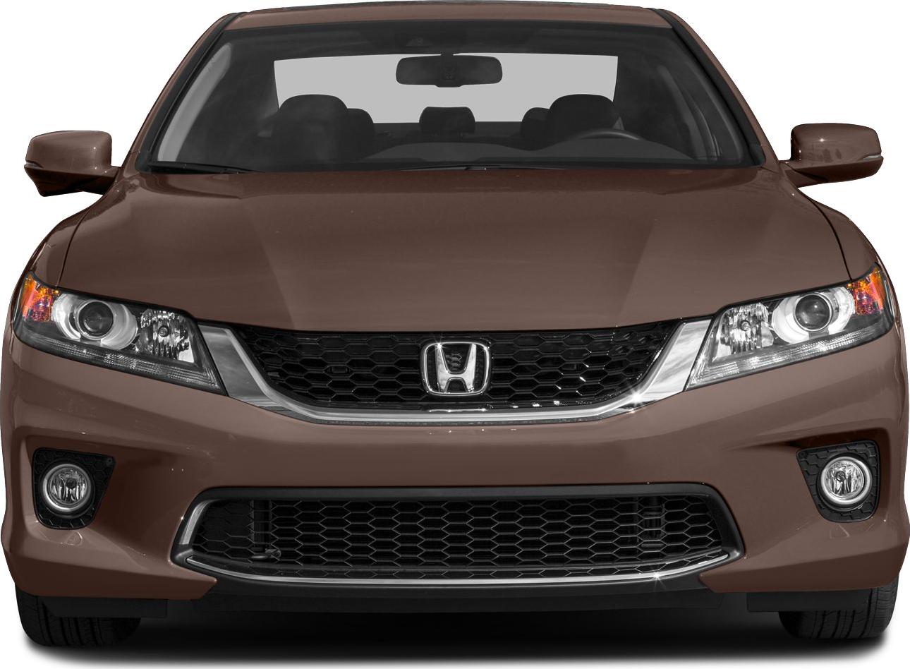 Front view of a coupe with grille, headlights, and fog lights