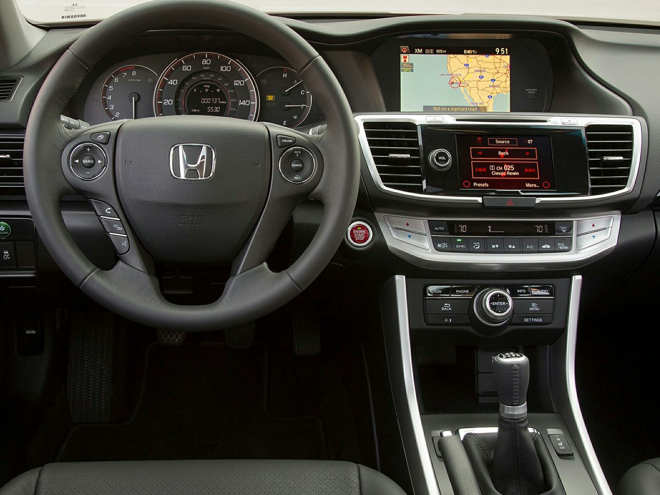 Steering wheel with controls and dual infotainment screens