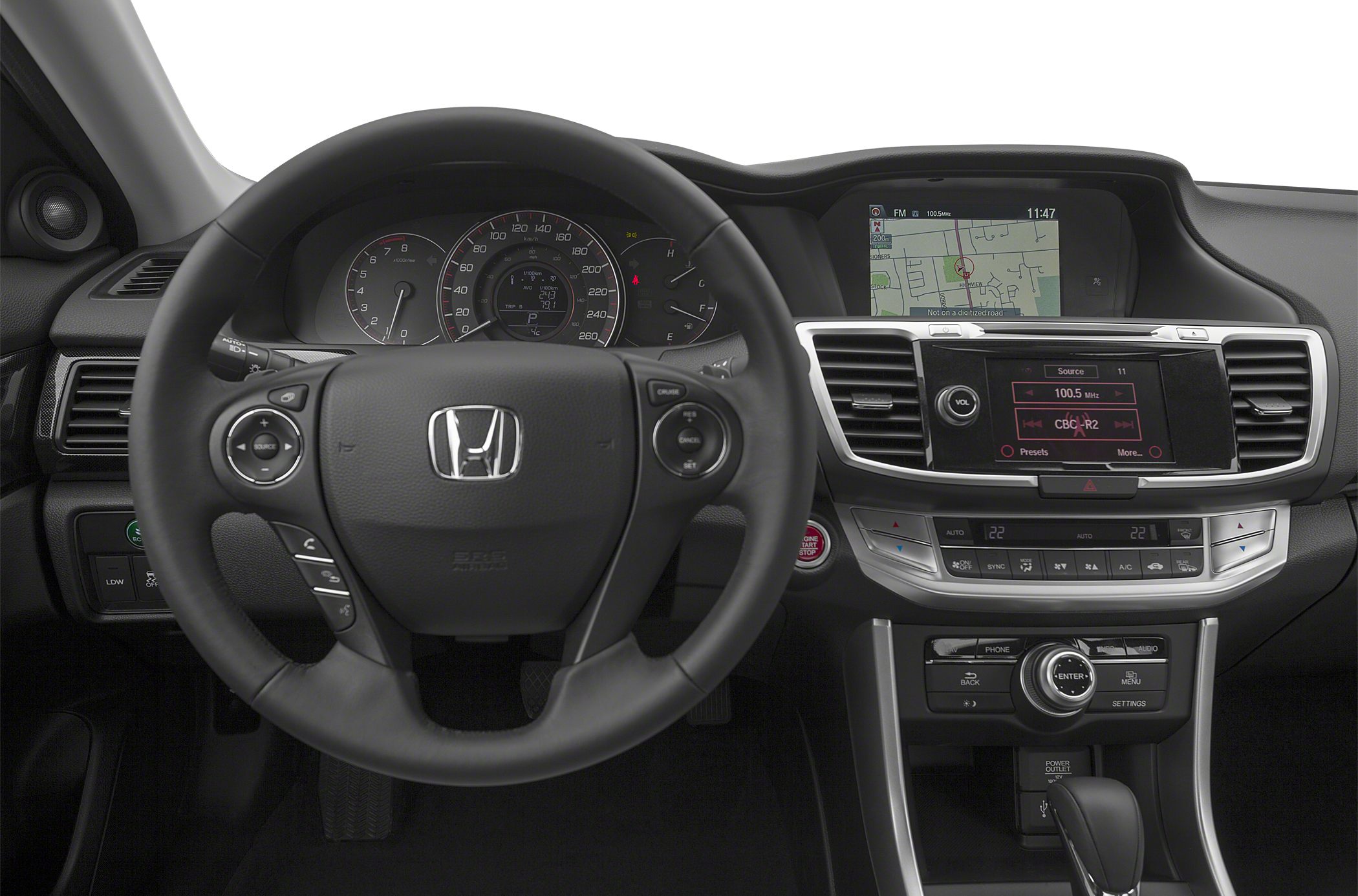 Steering wheel and dual infotainment screens with climate controls