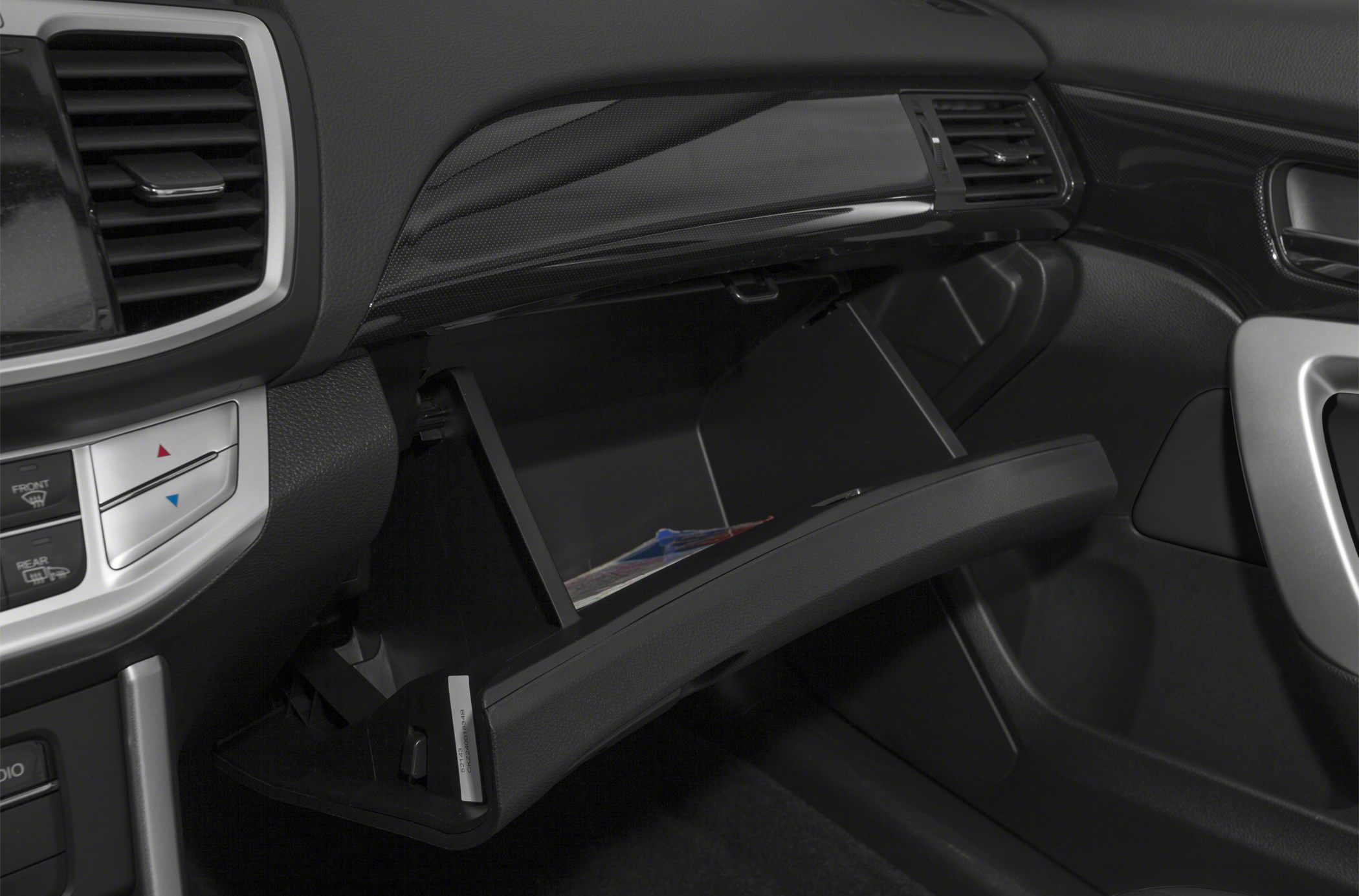Open glove box storage in car interior