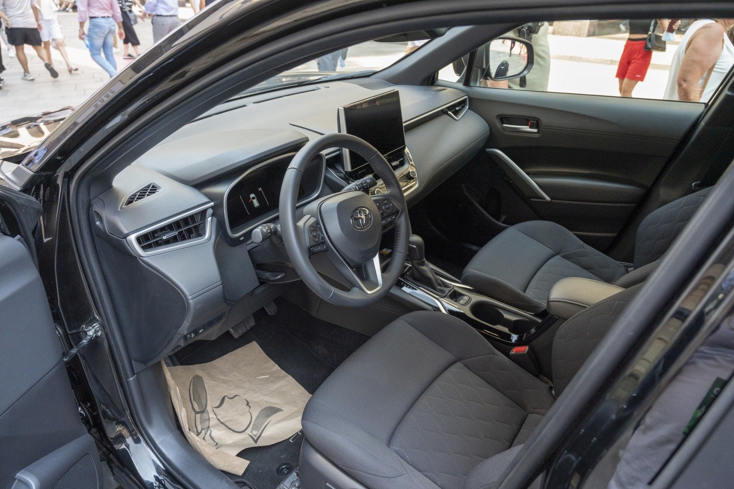 Modern dashboard with touchscreen and comfortable front seats.