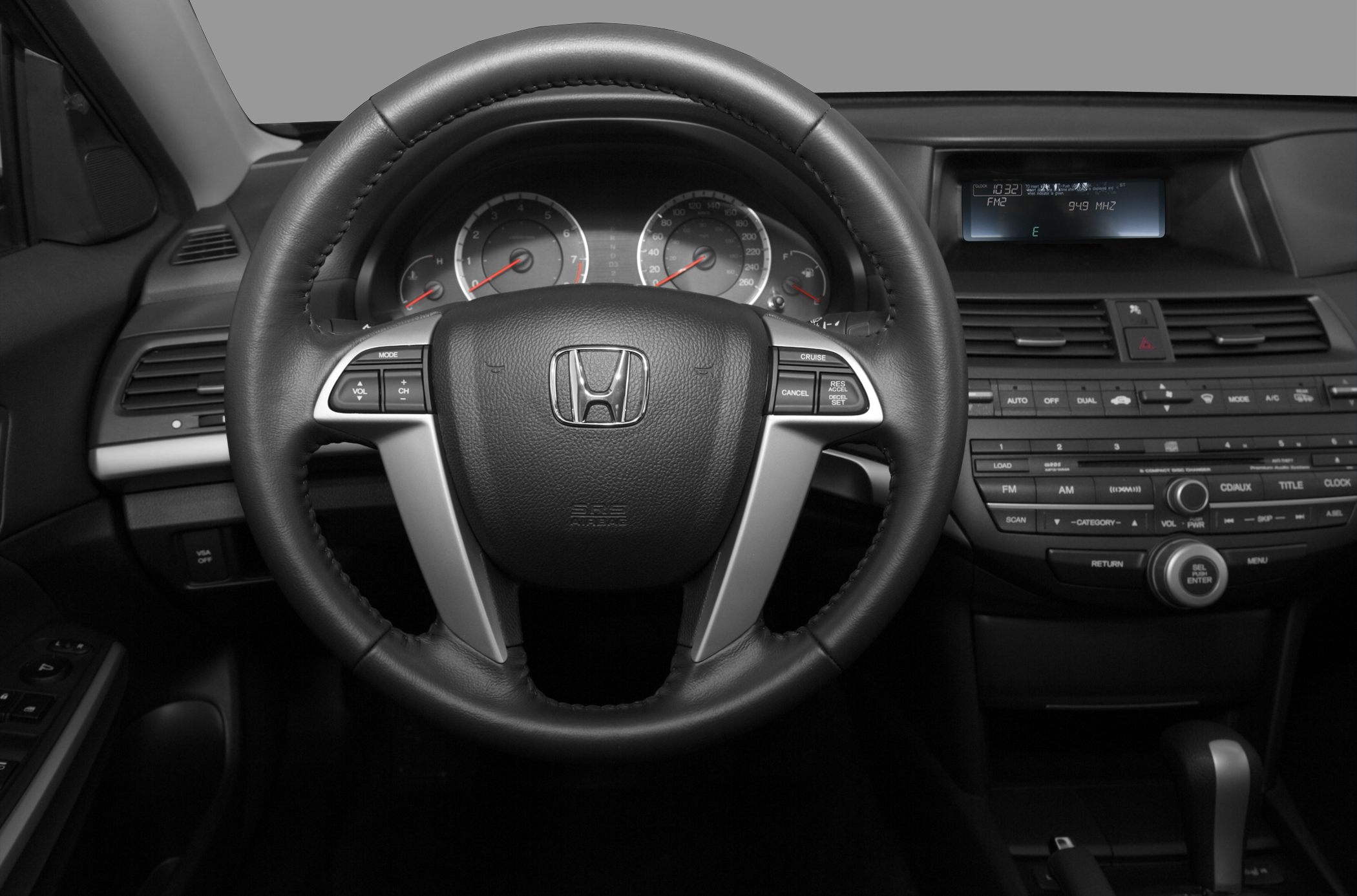 Steering wheel with instrument cluster and dashboard controls