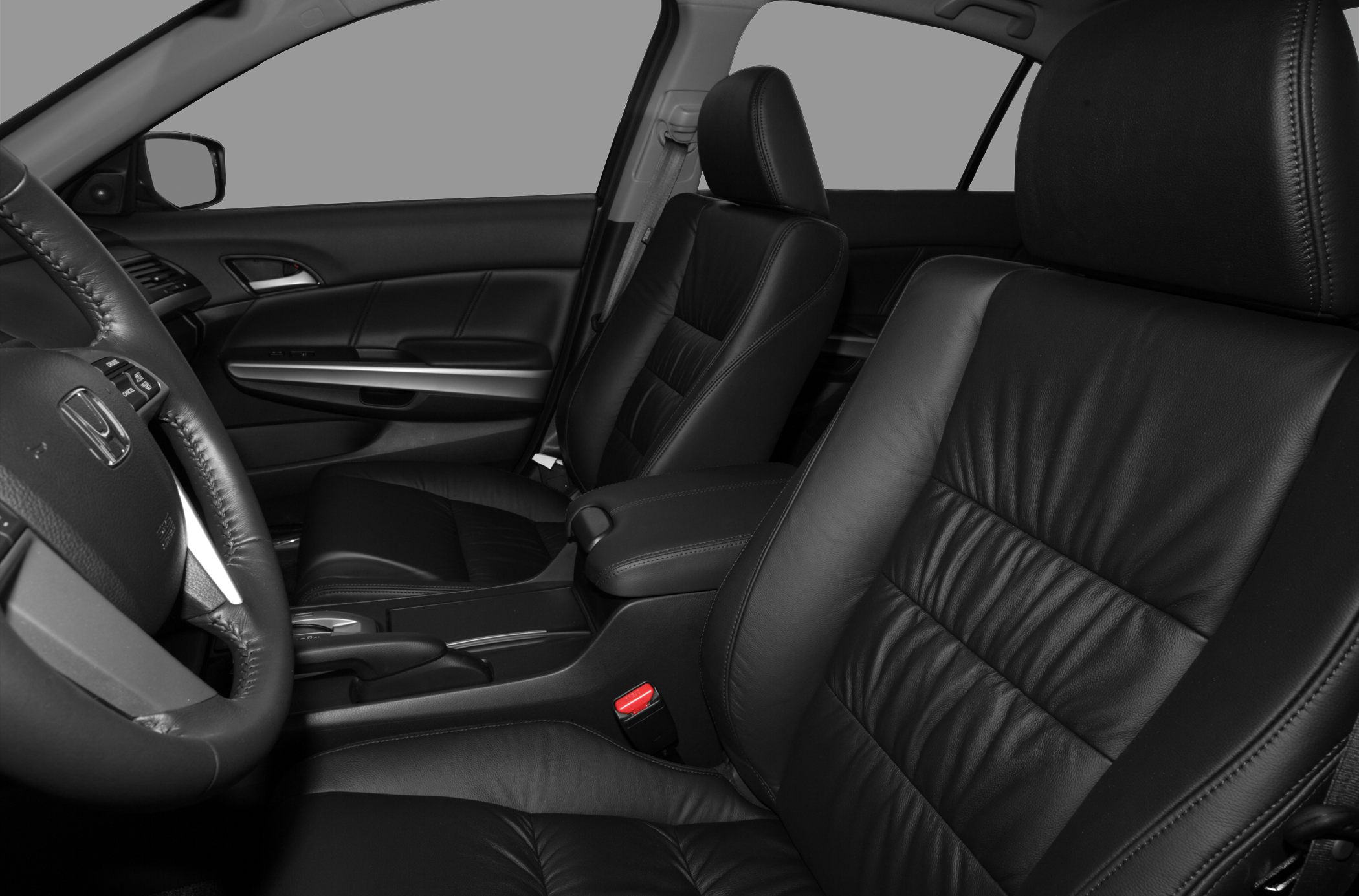 Black leather seats with detailed stitching and steering wheel