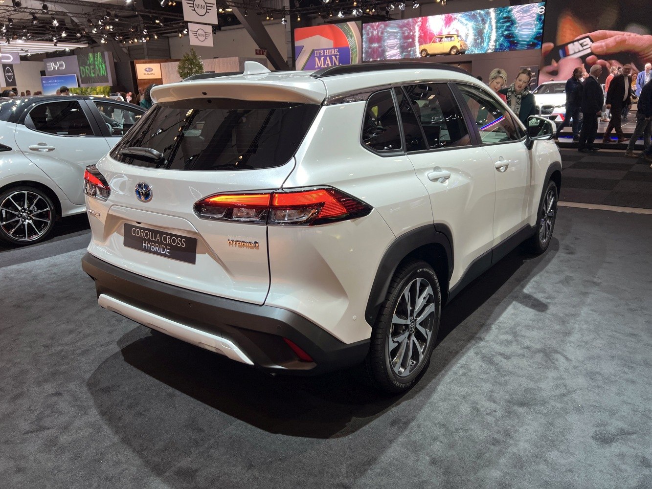 White hybrid SUV rear and side view with LED taillights and modern design