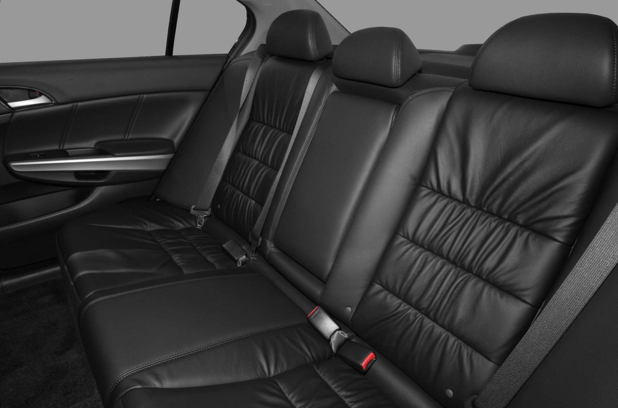 Black leather rear seats with seatbelts and door panel