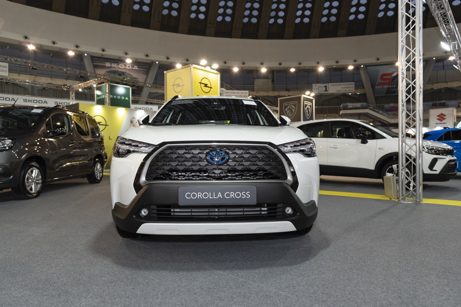 Front view with bold hexagonal grille and sharp LED headlights