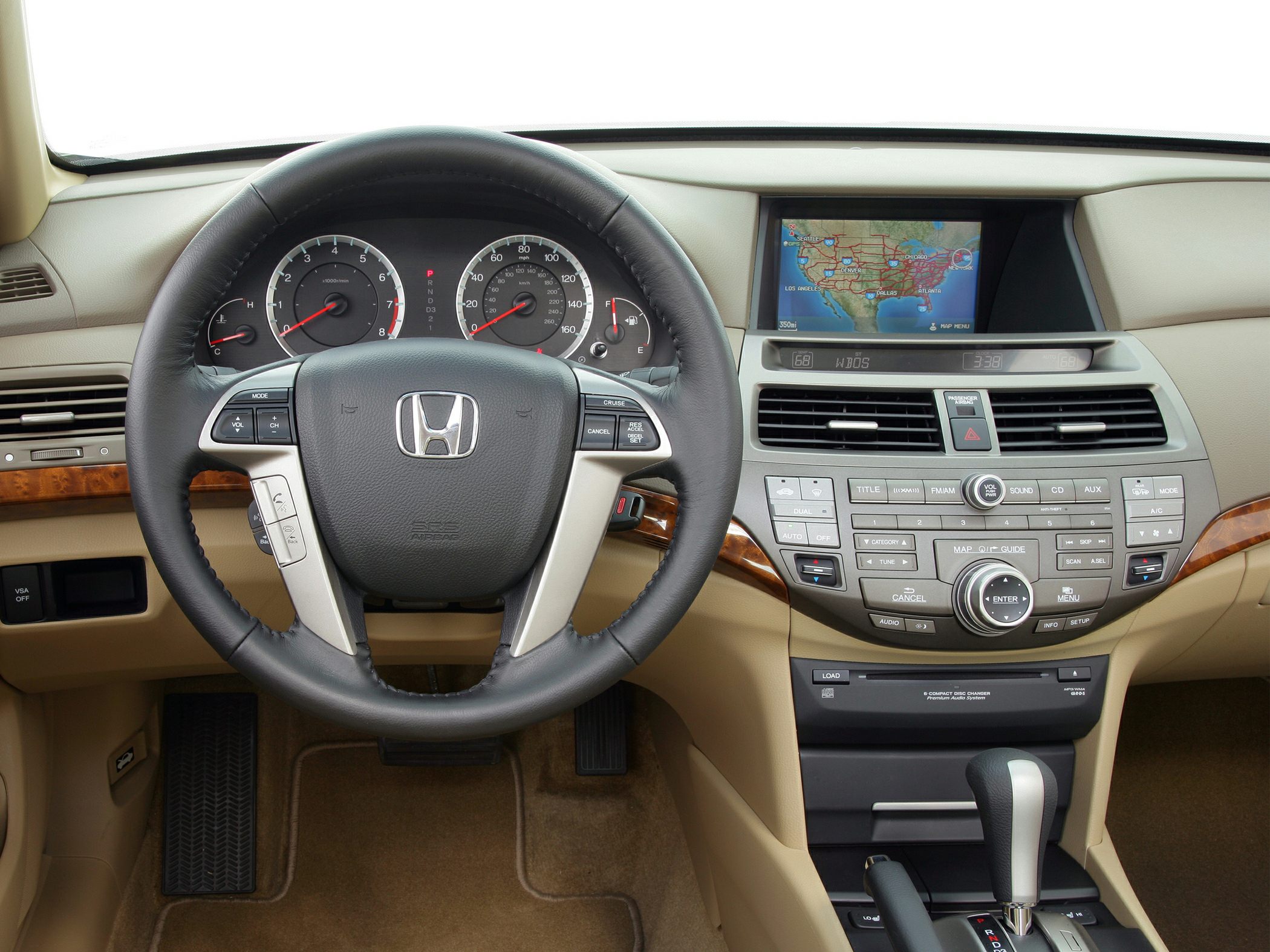 Steering wheel with controls and central dashboard navigation display