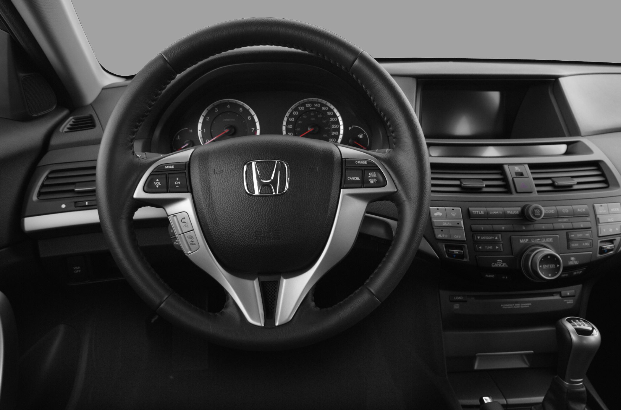 Multifunction steering wheel and dashboard center console with controls