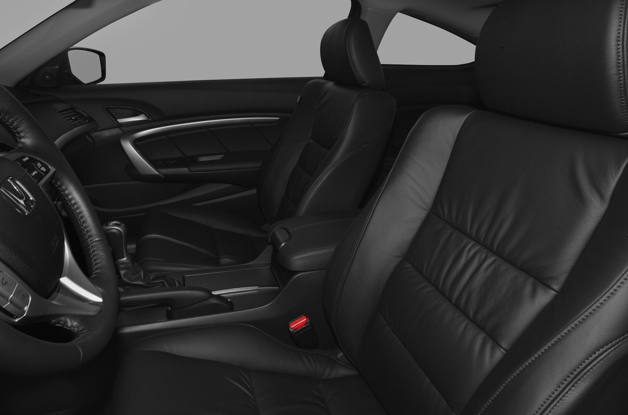 Black leather front seats with ergonomic design and steering wheel
