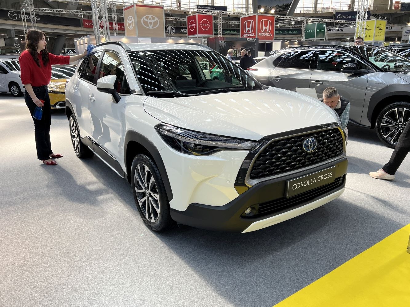 Front black honeycomb grille and LED headlights of an SUV