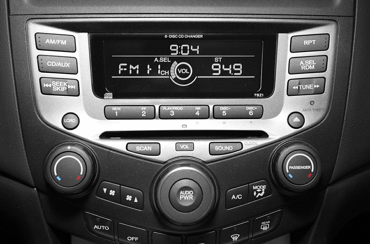 Car audio system and climate control panel with digital display and multiple buttons