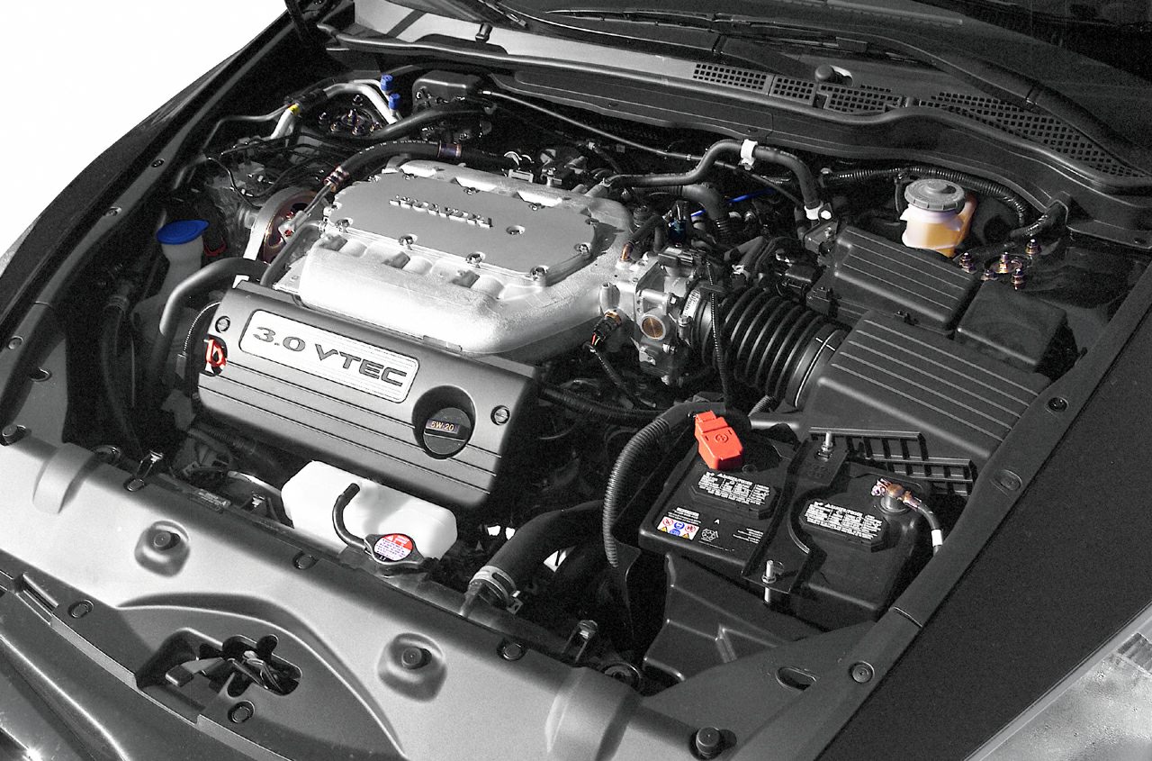 3.0 VTEC engine bay with components and car battery