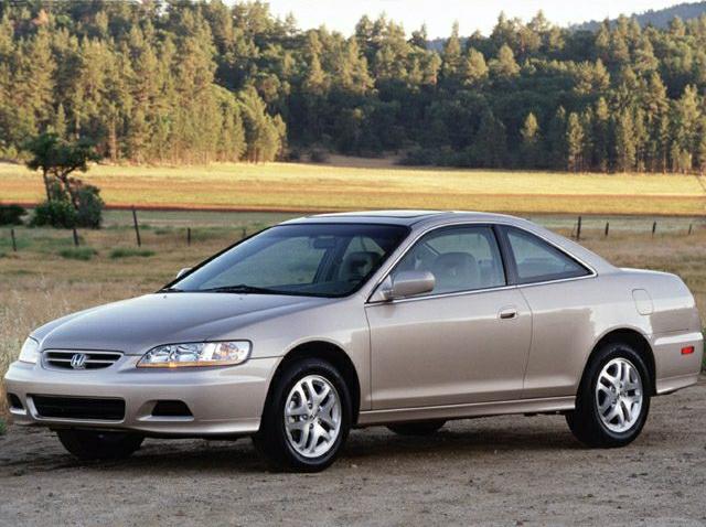Sporty two-door mid-size coupe with aerodynamic lines and alloy wheels