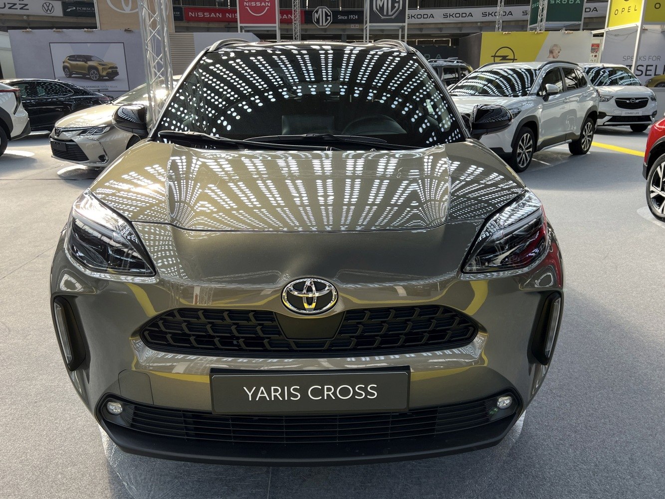 Front view of a compact crossover with sleek headlights and bold grille design