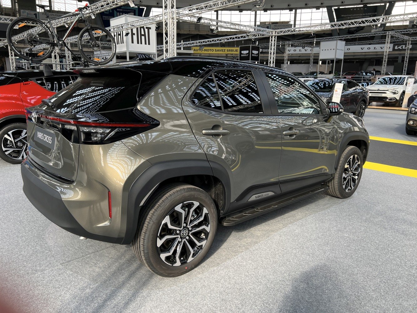 Rear and side view of compact SUV with two-tone paint and alloy wheels
