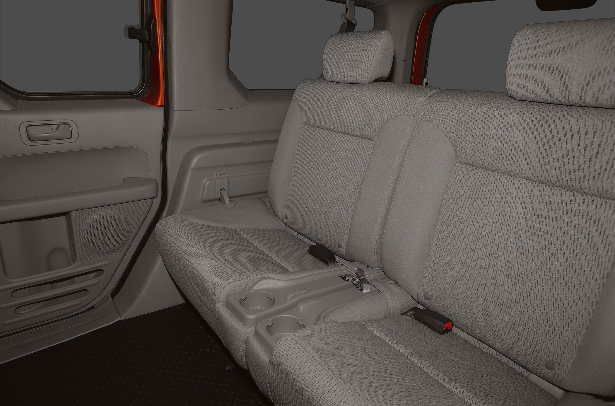 Rear seat with cloth upholstery and integrated cup holders