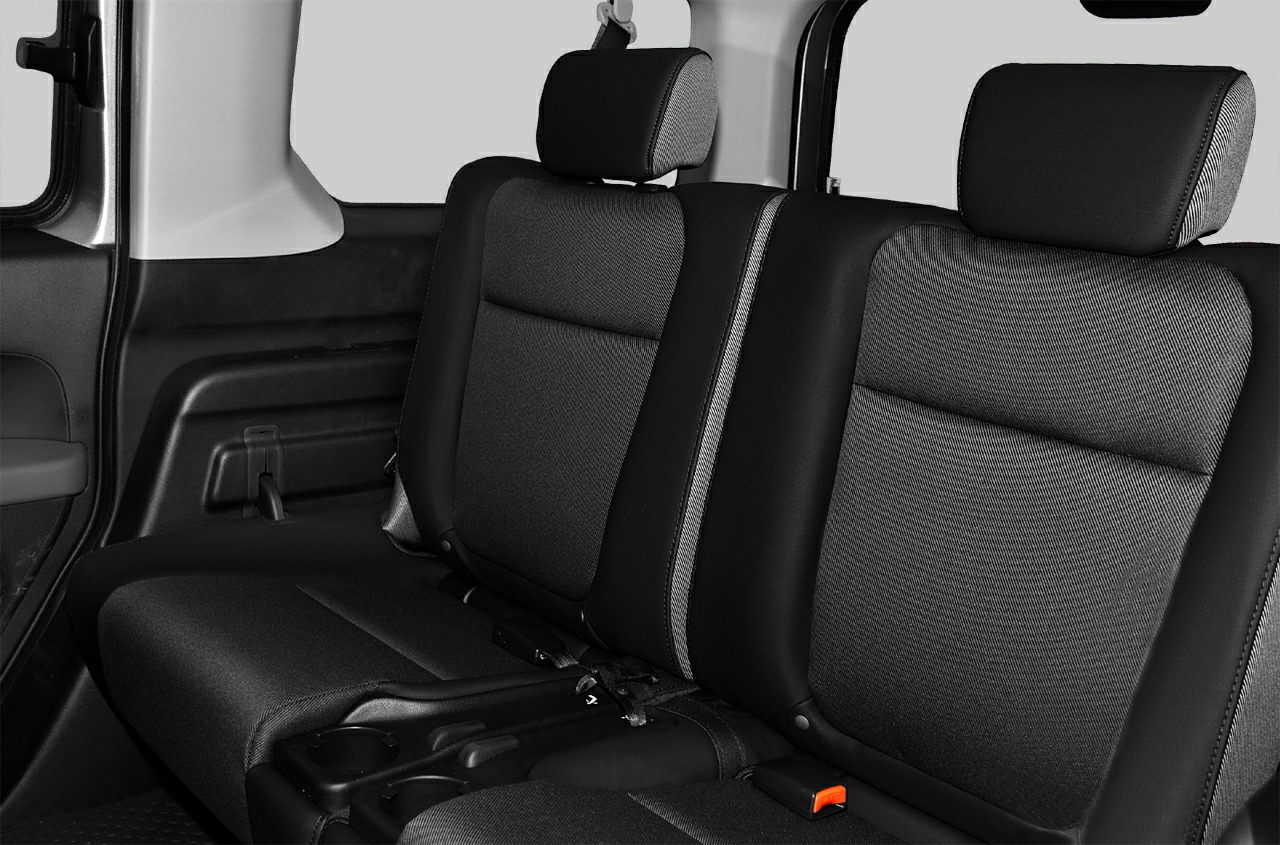 Rear seat with fabric upholstery and headrests