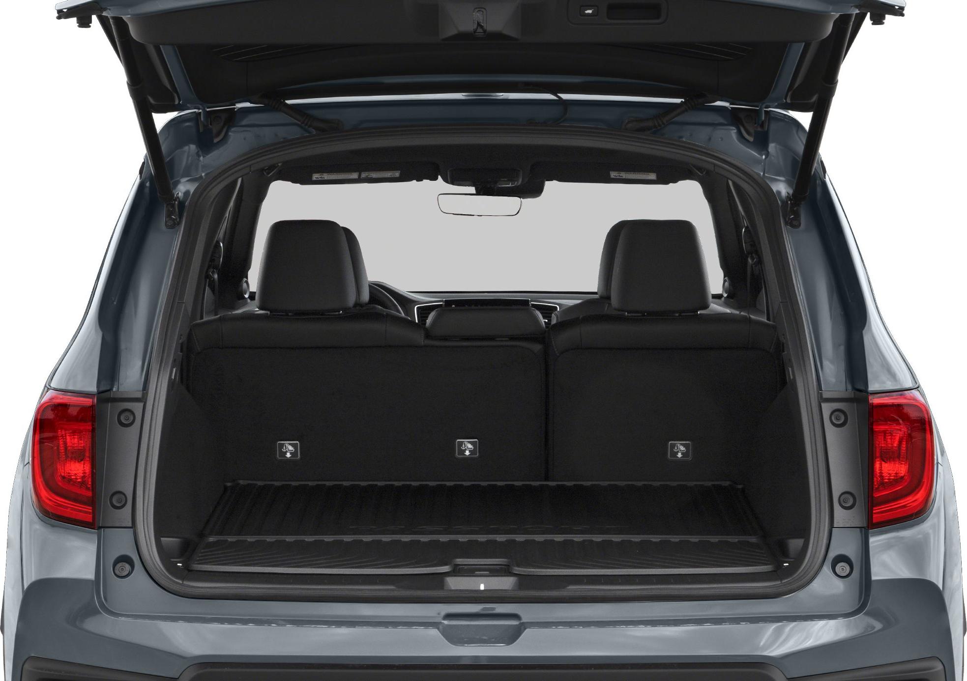Open SUV rear cargo space with seats upright and protective floor mat