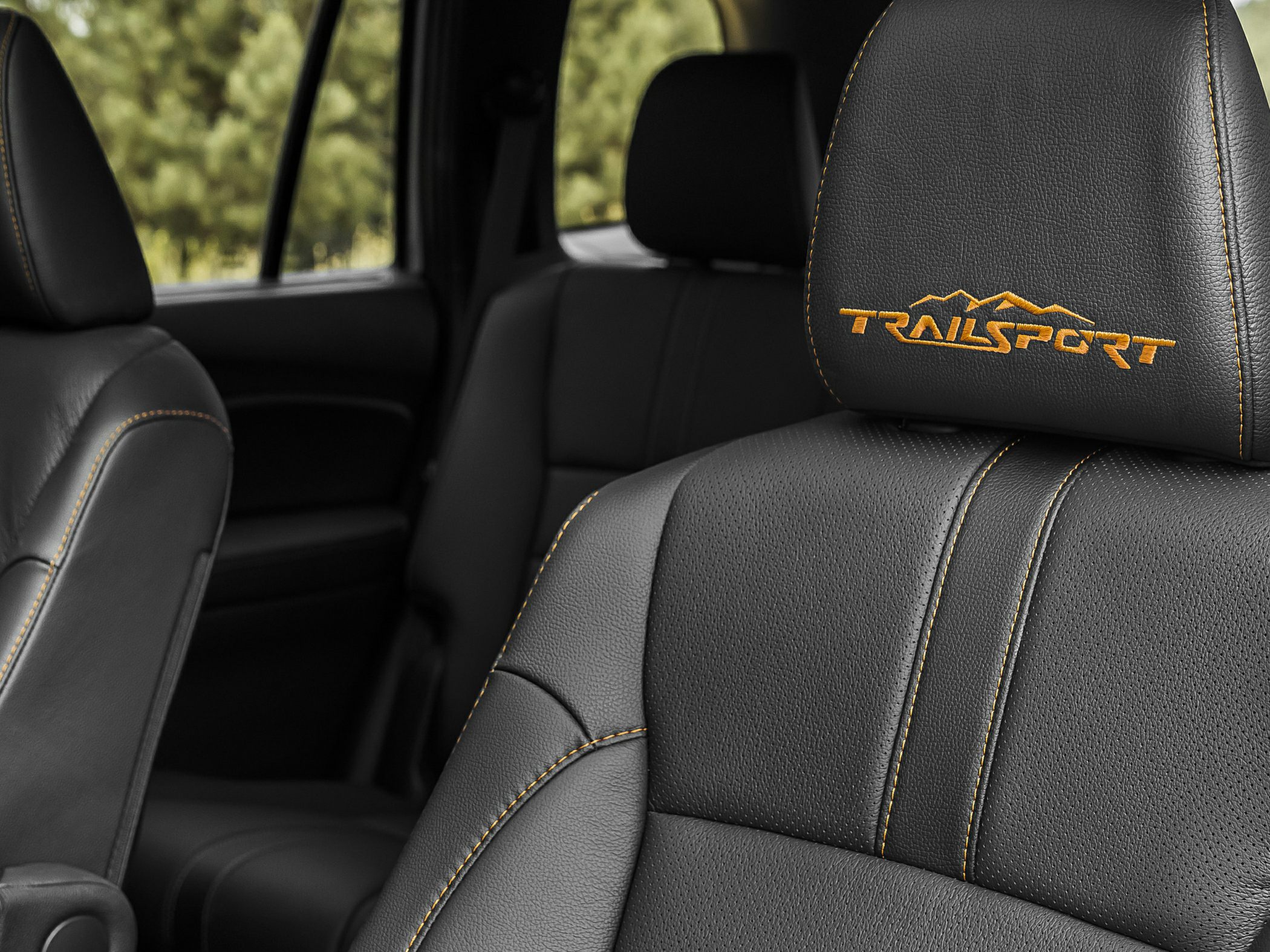Leather seat with yellow contrast stitching and TrailSport embroidery