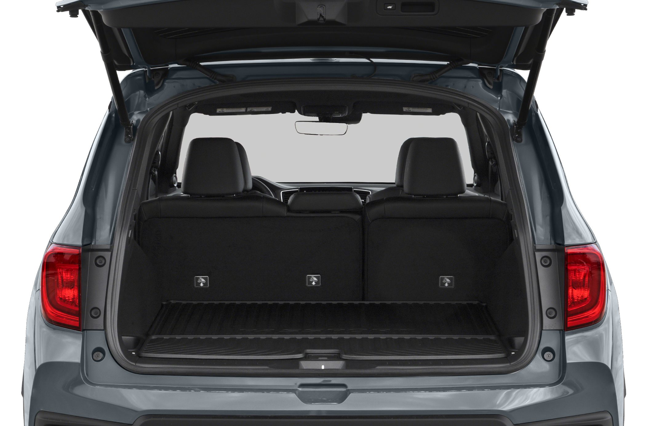 Open SUV tailgate with spacious cargo area and rear seats visible
