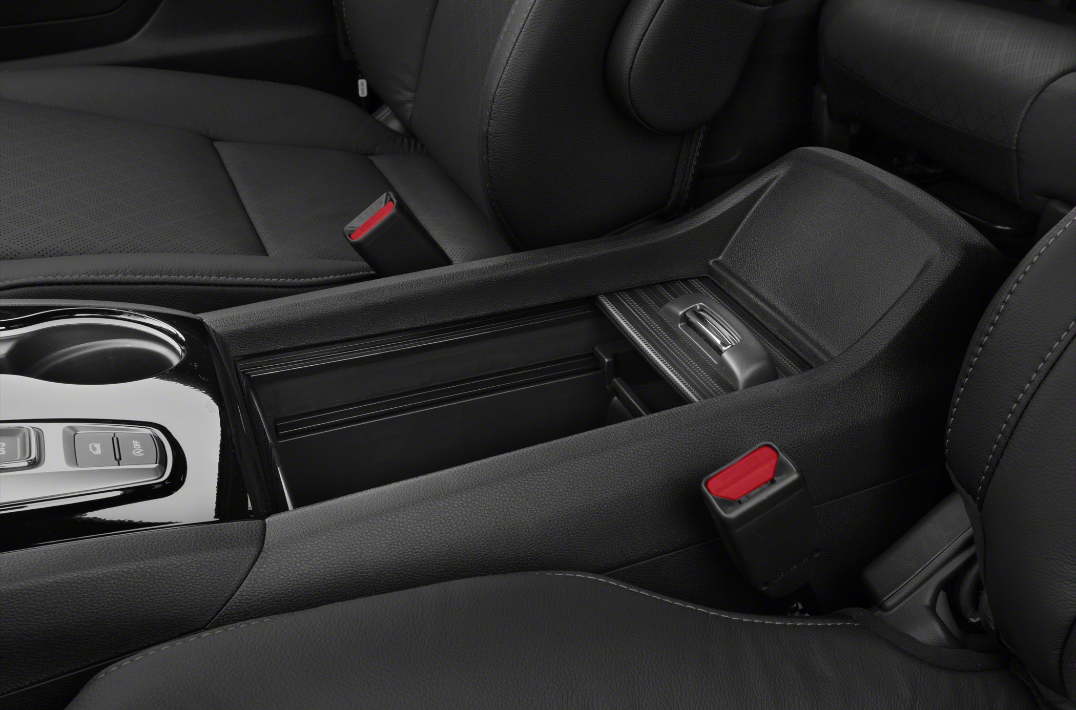 Black leather interior with center console storage and seatbelt buckles