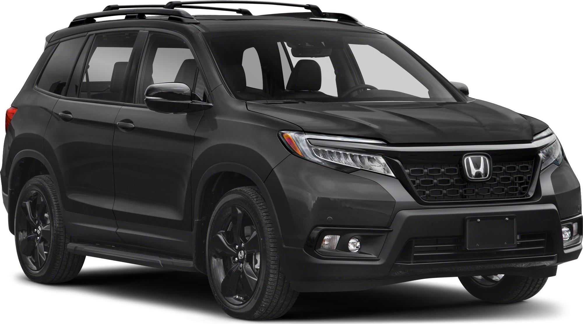 Black SUV with front grille, roof rails, and sporty wheels