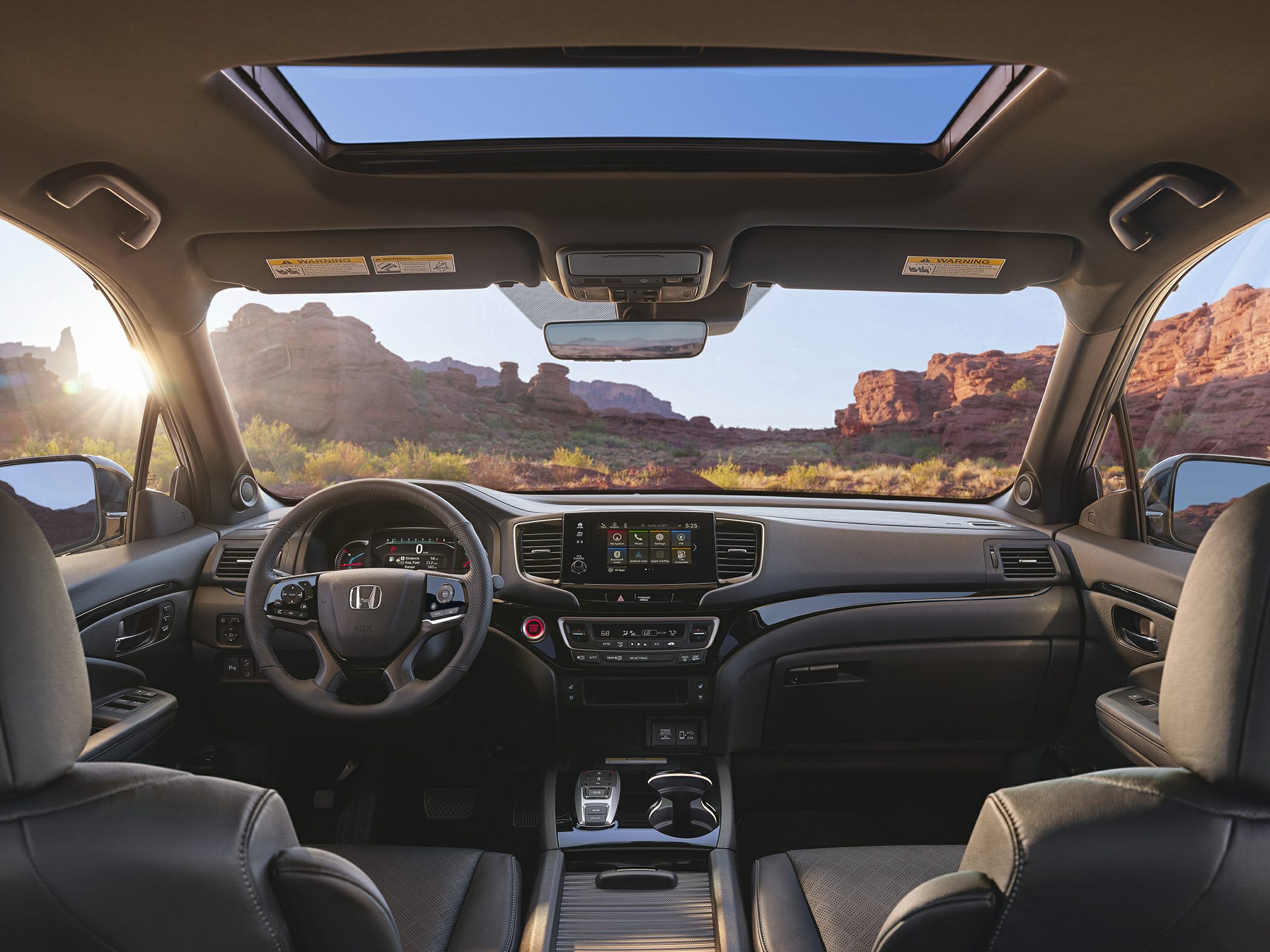Panoramic sunroof, digital dashboard, modern infotainment system in SUV interior
