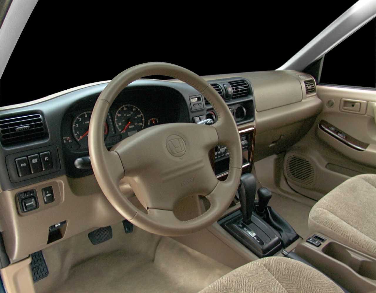 Beige interior with dashboard, steering wheel, and center console